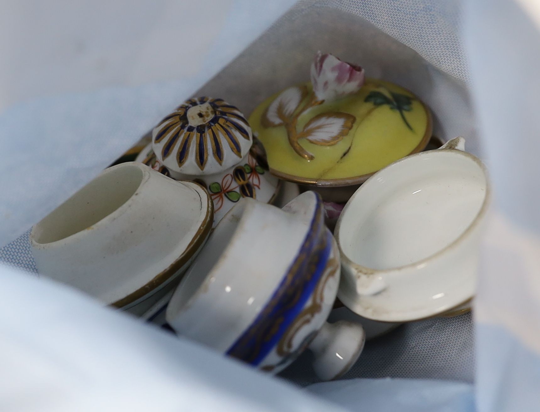 A mixed group of 18th century blue and white covers, and others smaller, enamelled